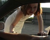 Cool red girl sucks a prick in the back seat of the car